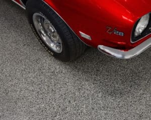 coating system chipped red car in garage garagefloorcoating.com 