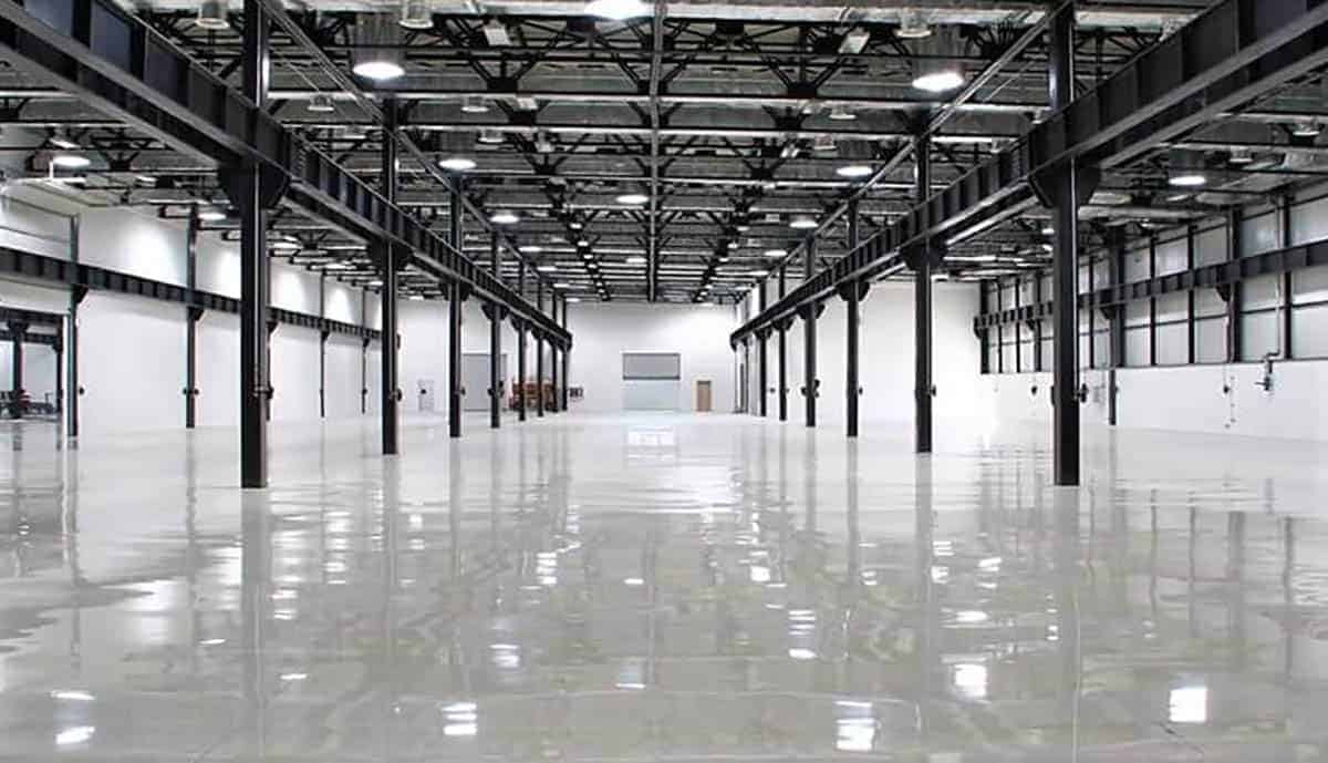 Large commercial space coated with gray high gloss epoxy flooring